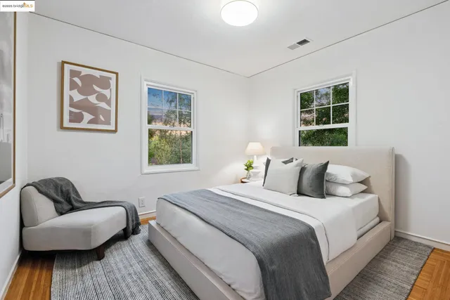 a bedroom with a bed and a couch