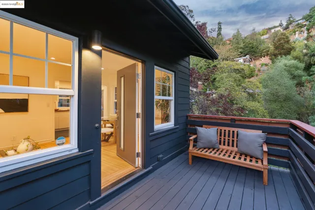 a bedroom with furniture and a large window