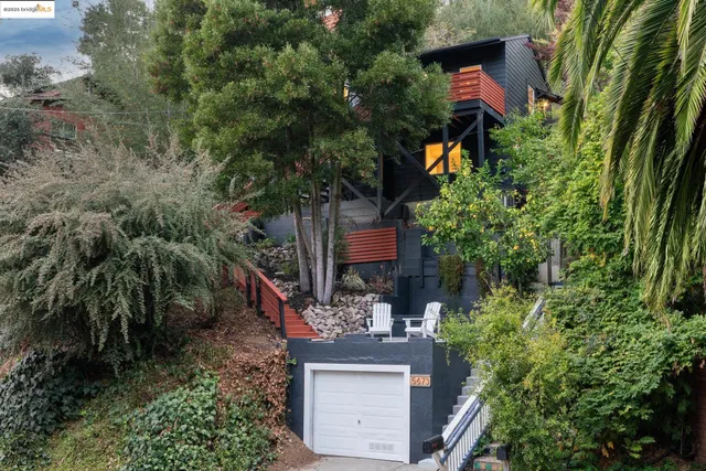 a view of a house with a tree