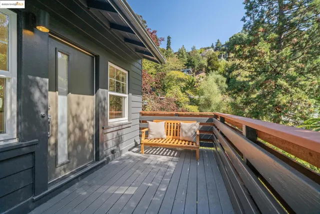 a view of balcony with wooden floor and fence