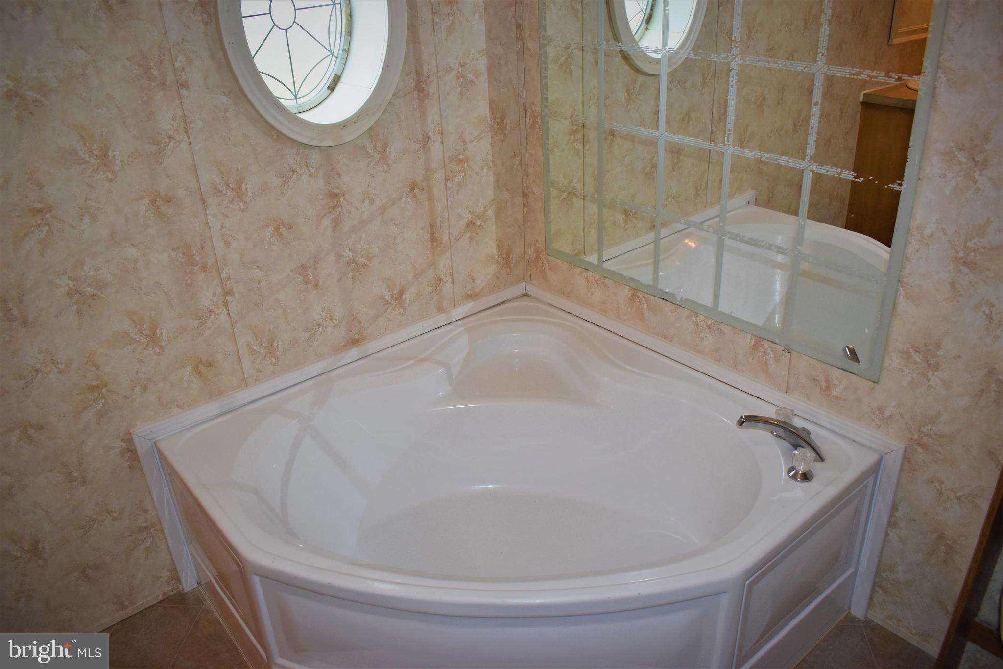 1650 Cypress Branch Road Magnolia, DE 19962 - Photo 16 of 34 a bathroom with a bathtub