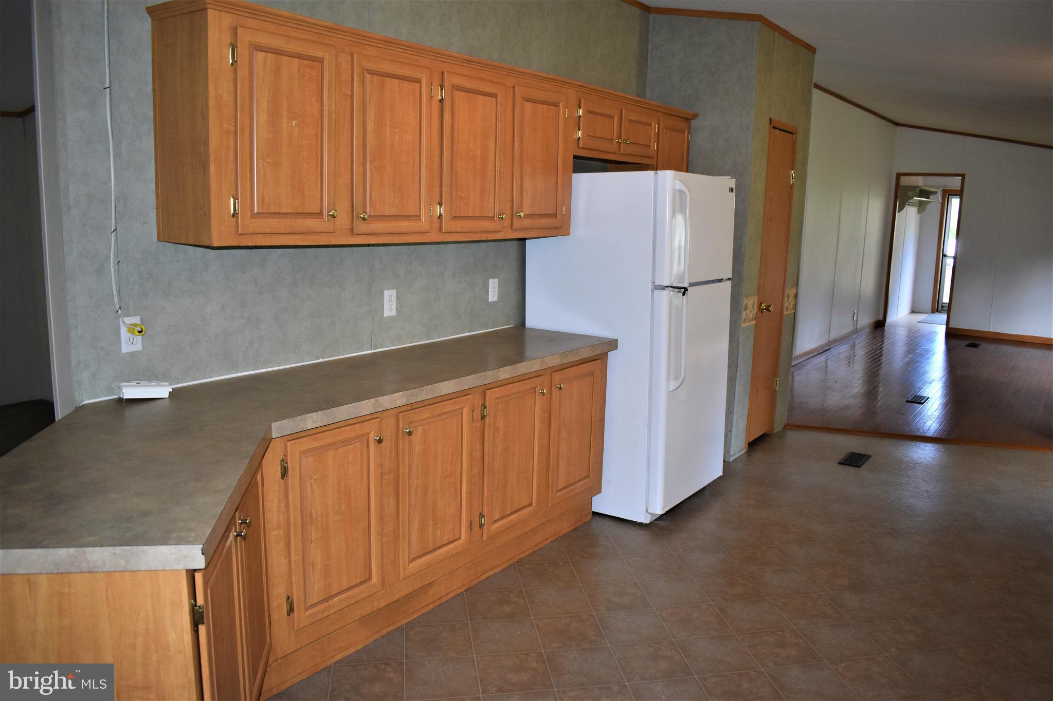 1650 Cypress Branch Road Magnolia, DE 19962 - Photo 22 of 34 a kitchen with stainless steel appliances granite countertop a refrigerator a stove and a sink
