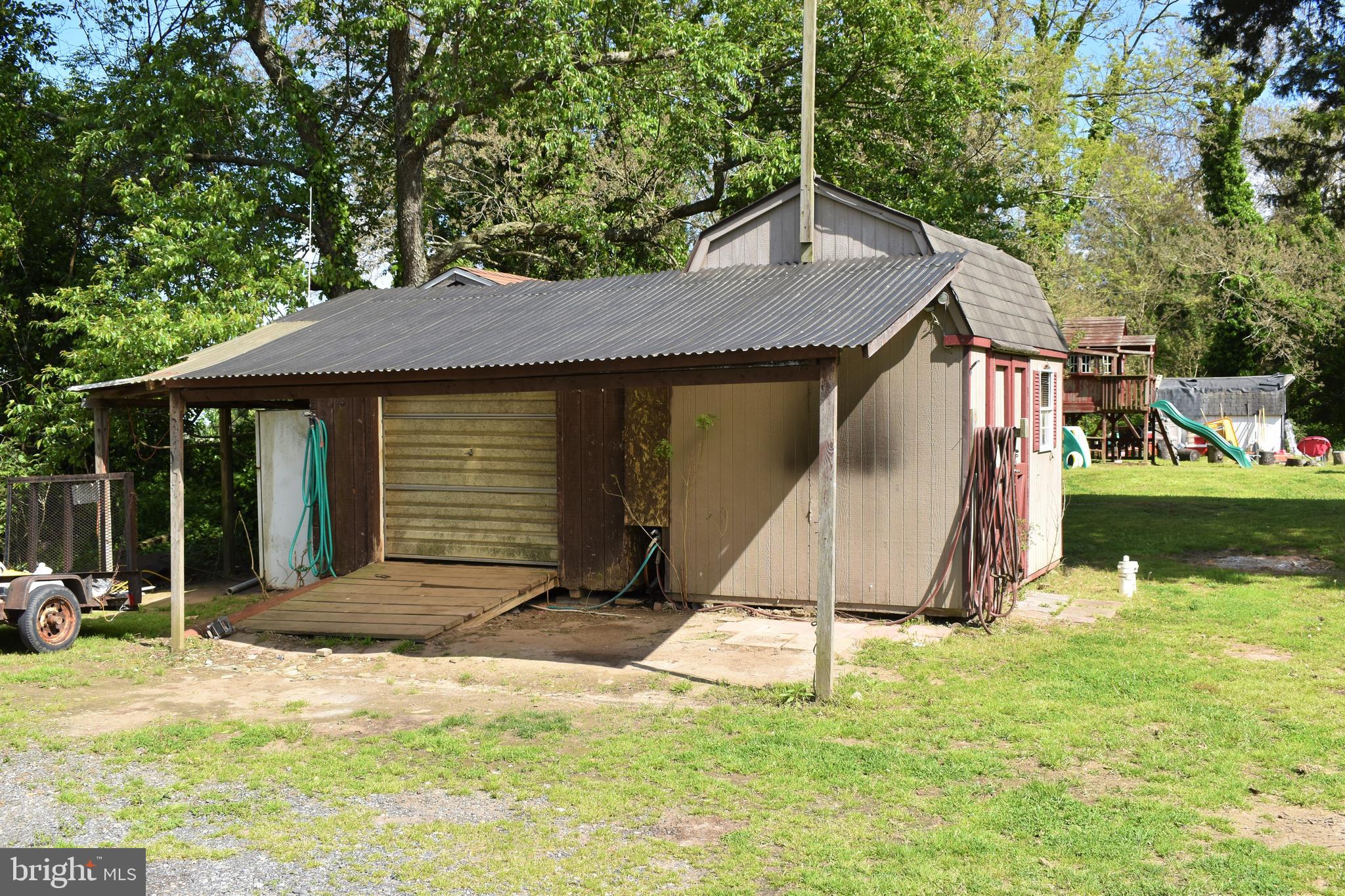 1650 Cypress Branch Road Magnolia, DE 19962 - Photo 4 of 34 a house with trees in the background