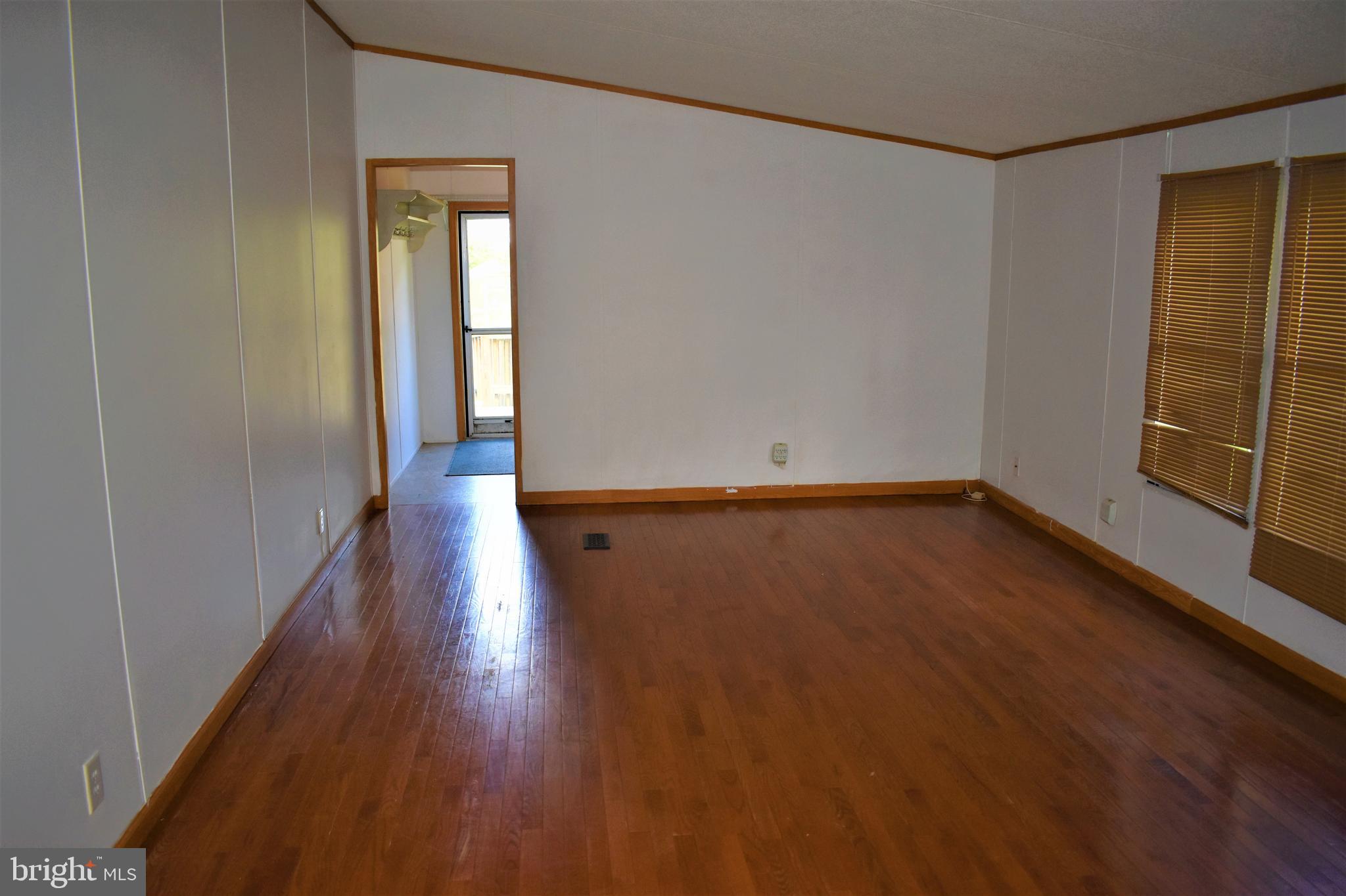 1650 Cypress Branch Road Magnolia, DE 19962 - Photo 10 of 34 a view of a room with wooden floor and a window