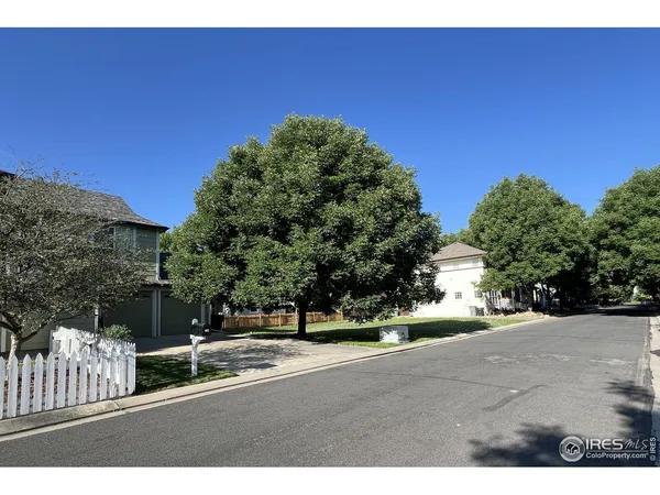 a view of a road with a building in the background