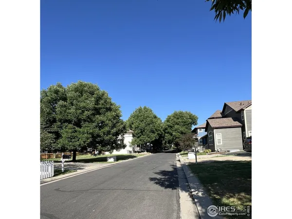 a picture of a couple of cars parked in front of a building