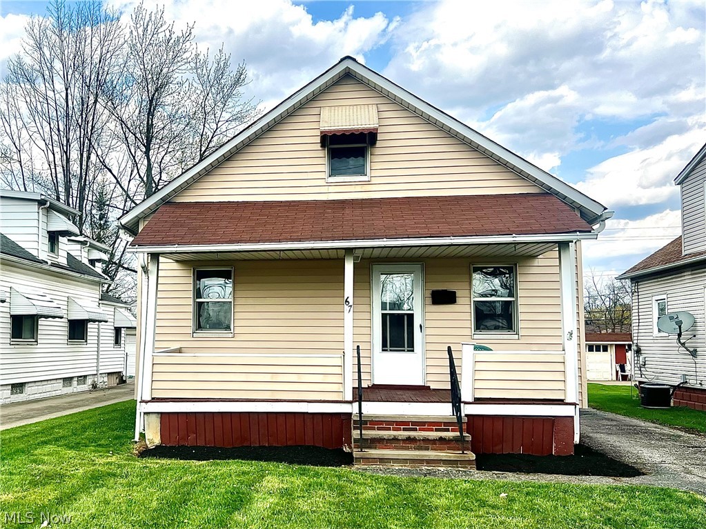 67 Forbes Road Bedford, OH 44146 - Photo 1 of 20 View of front of home with a front yard and covered porch
