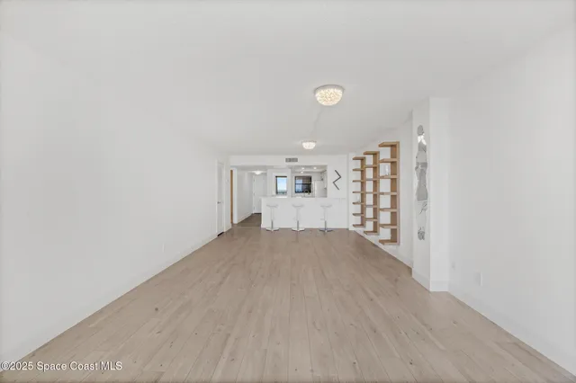 a large white kitchen with white cabinets