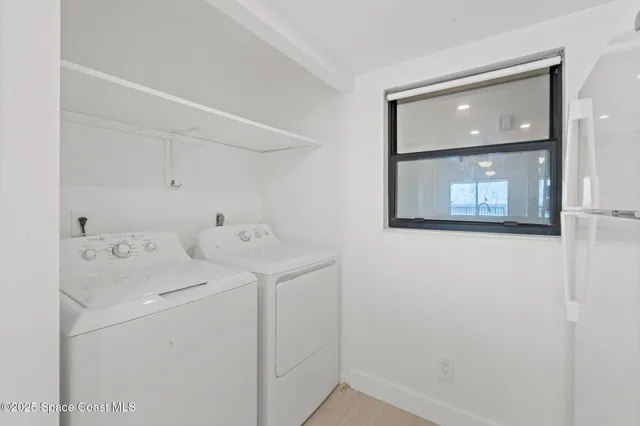 a kitchen with white cabinets and a sink
