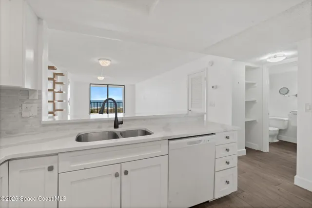 a kitchen with a sink and a window