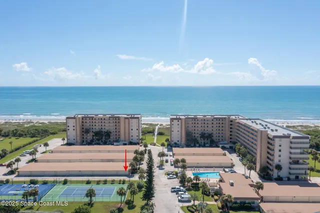 a view of a garage with parked cars