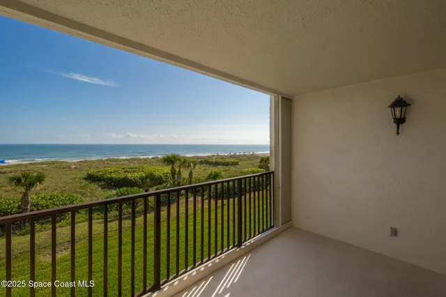 a view of a balcony with an ocean view