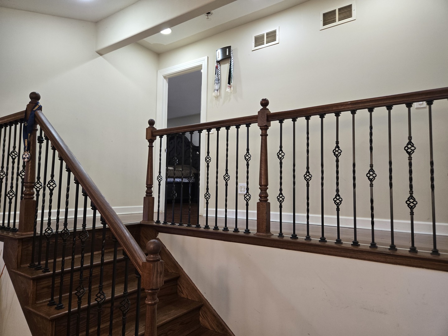 3303 East Exchange Street Crete, IL 60417 - Photo 12 of 38 a view of staircase with lots of frames on wall