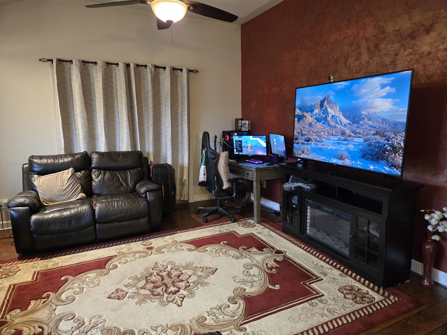 3303 East Exchange Street Crete, IL 60417 - Photo 13 of 38 a living room with furniture a flat screen tv and a fireplace