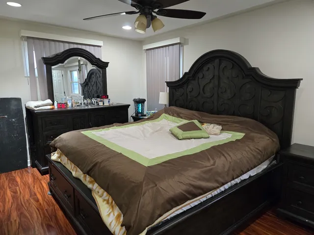 a bedroom with a bed and window