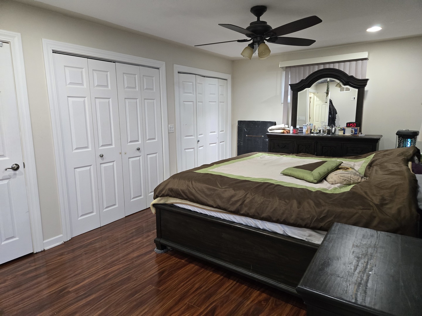 3303 East Exchange Street Crete, IL 60417 - Photo 16 of 38 a bedroom with a bed and a chandelier