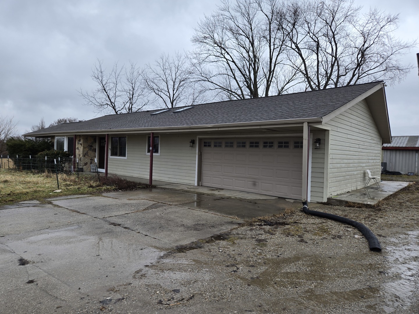 3303 East Exchange Street Crete, IL 60417 - Photo 2 of 38 a front view of a house with a yard and garage