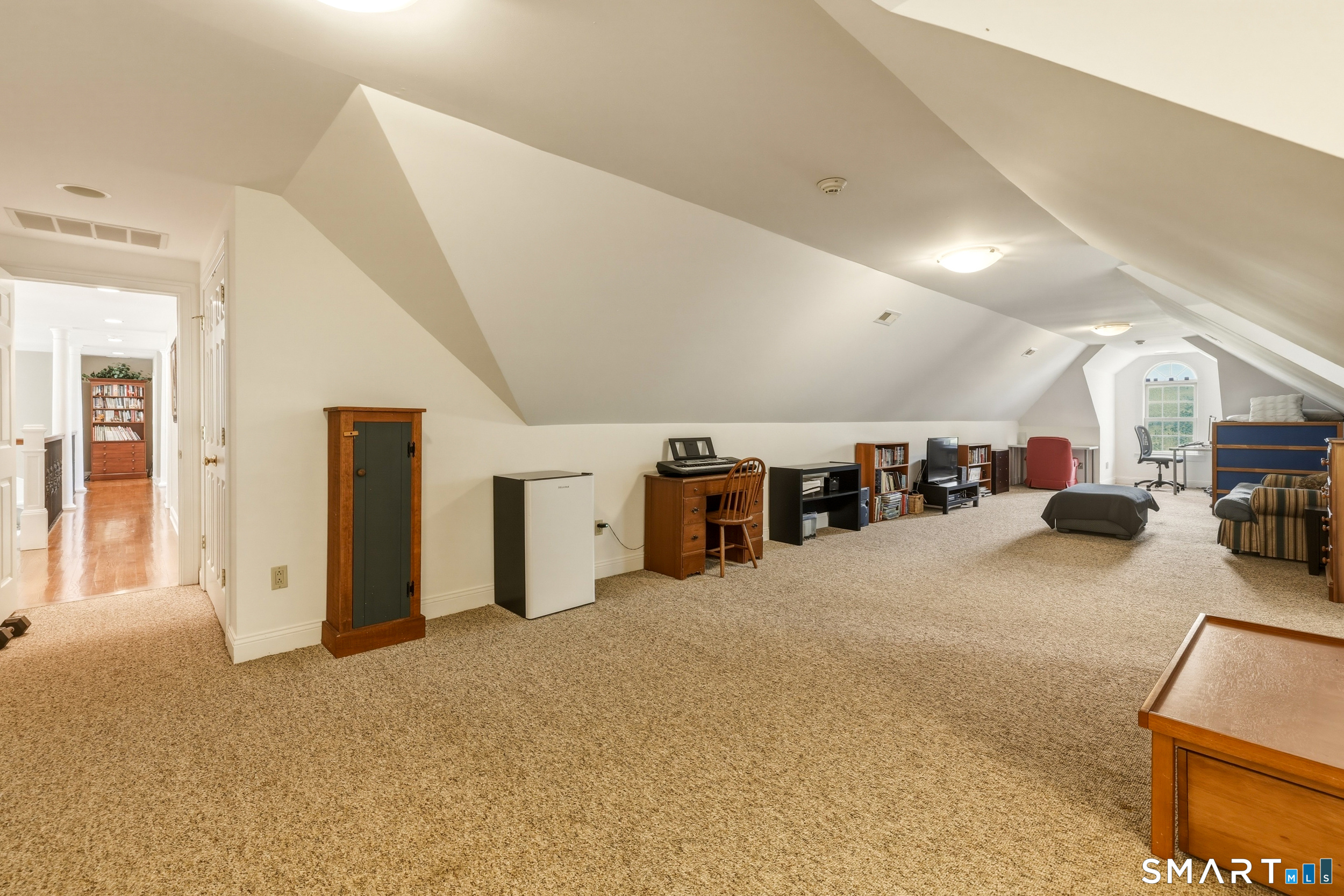 122 Lower Road Guilford, CT 06437 - Photo 26 of 40 A "bonus" room provides flexible space for guests, home office, or recreation.