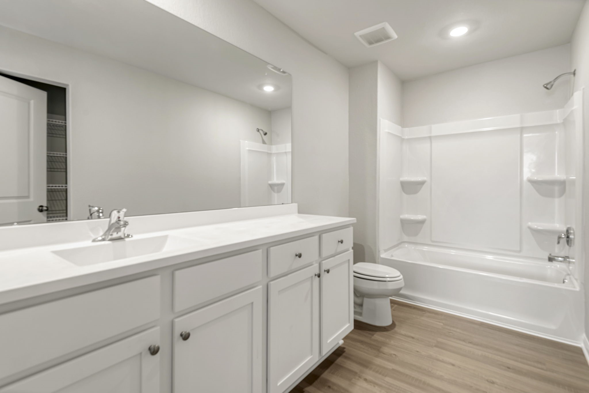 6416 Winter Elm Street Houston, TX 77048 - Photo 7 of 8 a bathroom with a double vanity sink toilet and shower