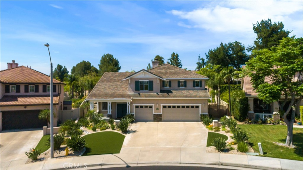 33351 Nicholas Common Temecula, CA 92592 - Photo 38 of 42 a front view of a house with a garden