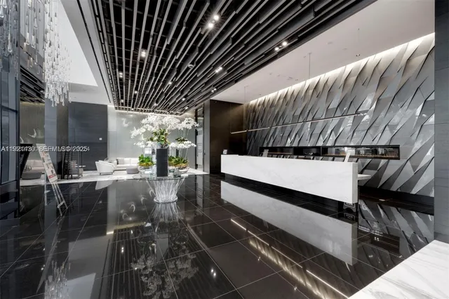 a view of a room with lots of wooden furniture