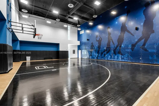 a view of a tennis ground with a small park