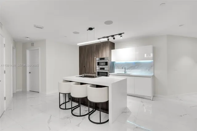 a bedroom with a bed and a television