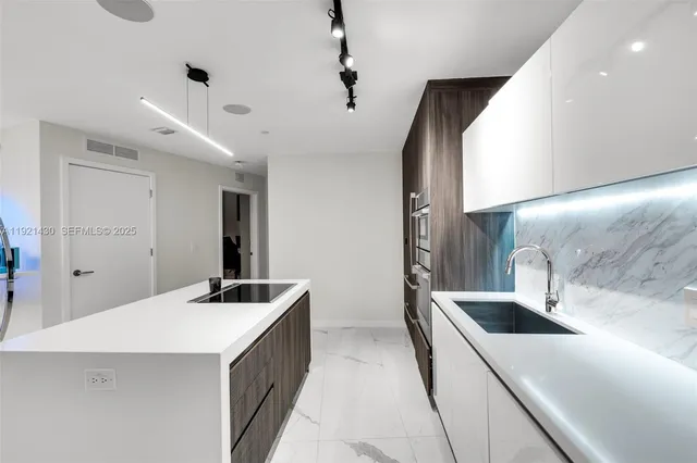 a bedroom with a bed and a large mirror