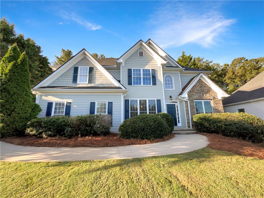 5153 Maplewood Lane Gainesville, GA 30504 - Photo 1 of 1 a front view of a house with a yard