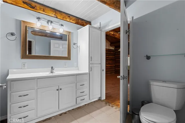 a bathroom with a sink a vanity and a mirror