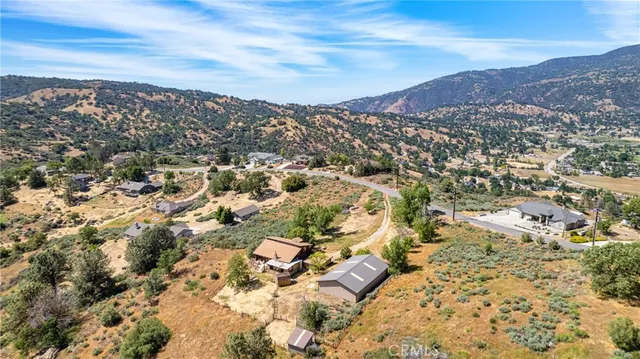 a view of a backyard with sitting area