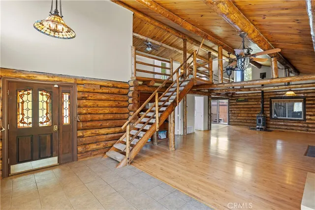 a view of entryway with stairs and wooden floor
