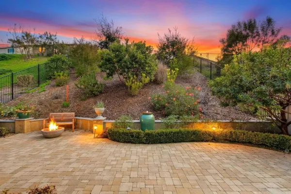 a view of a house with outdoor seating space