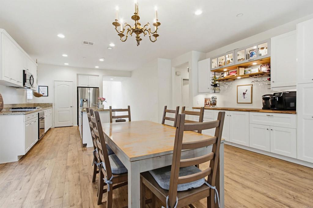 35647 Garrano Lane Fallbrook, CA 92028 - Photo 13 of 67 a view of a dining room with furniture and wooden floor