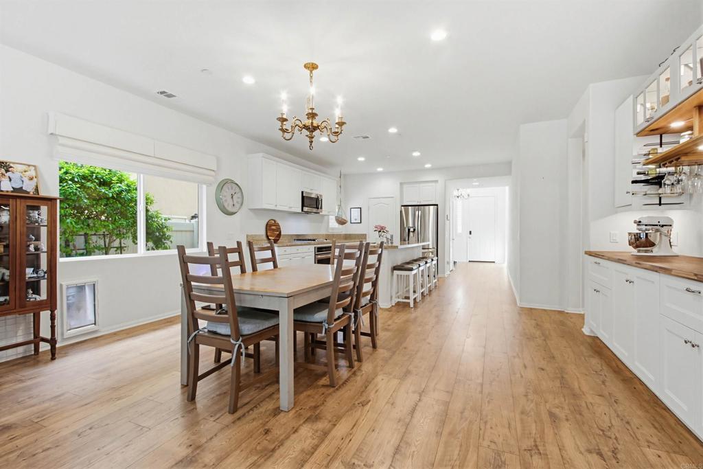 35647 Garrano Lane Fallbrook, CA 92028 - Photo 14 of 67 a view of a dining room with furniture and wooden floor