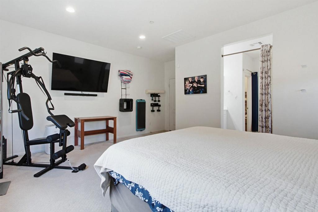 35647 Garrano Lane Fallbrook, CA 92028 - Photo 22 of 67 a bedroom with a bed and a flat screen tv