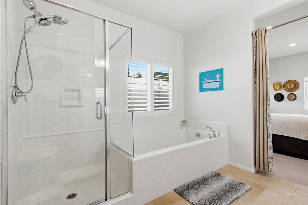 35647 Garrano Lane Fallbrook, CA 92028 - Photo 25 of 67 a bathroom with a bathtub and a shower