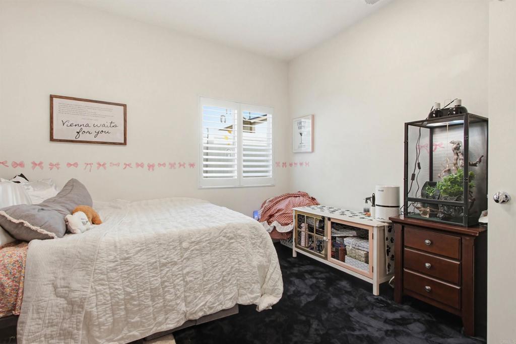 35647 Garrano Lane Fallbrook, CA 92028 - Photo 28 of 67 a bedroom with a bed and a dresser