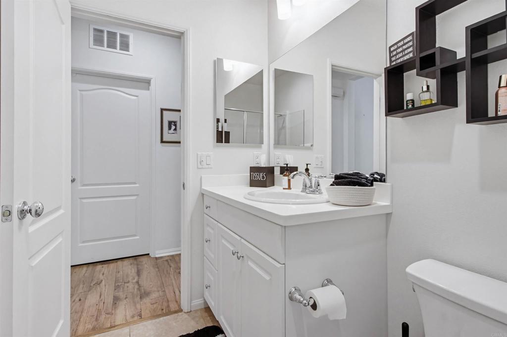 35647 Garrano Lane Fallbrook, CA 92028 - Photo 30 of 67 a bathroom with a sink a toilet and a mirror