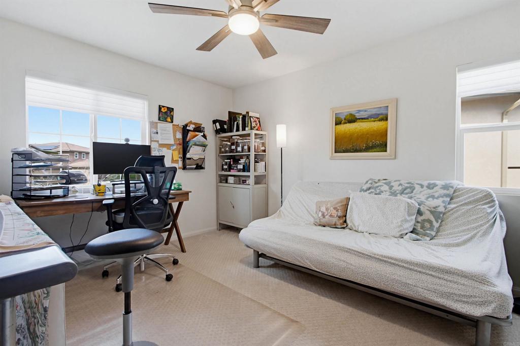 35647 Garrano Lane Fallbrook, CA 92028 - Photo 35 of 67 a living room with furniture and a flat screen tv