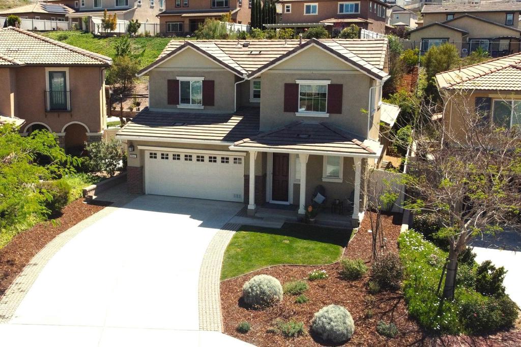 35647 Garrano Lane Fallbrook, CA 92028 - Photo 51 of 67 a front view of a house with a yard and garage