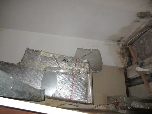 a view of kitchen with microwave and cabinets