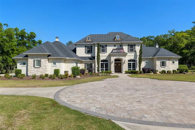 a living room with furniture large window and a fireplace
