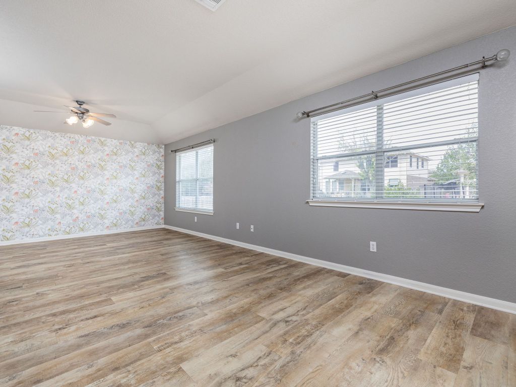 2349 Caprock Place Georgetown, TX 78626 - Photo 18 of 38 a view of empty room with wooden floor and fan