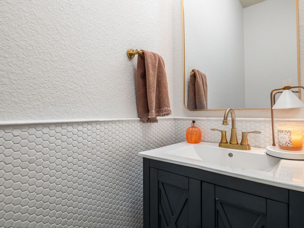 2349 Caprock Place Georgetown, TX 78626 - Photo 32 of 38 a bathroom with a sink and a mirror