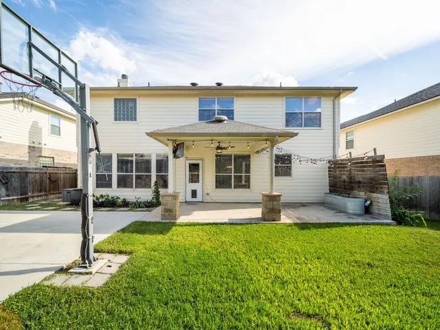 a view of a house with a yard porch and sitting area