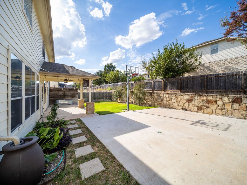 2349 Caprock Place Georgetown, TX 78626 - Photo 37 of 38 a view of a backyard with swimming pool and sitting area