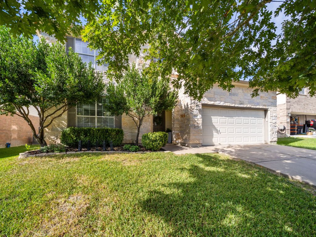 2349 Caprock Place Georgetown, TX 78626 - Photo 5 of 38 a front view of a house with a yard and garage