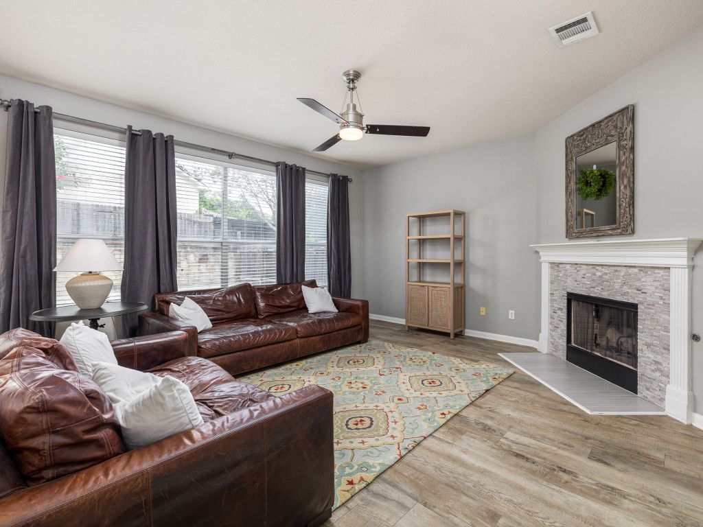 2349 Caprock Place Georgetown, TX 78626 - Photo 8 of 38 a living room with furniture and a fireplace