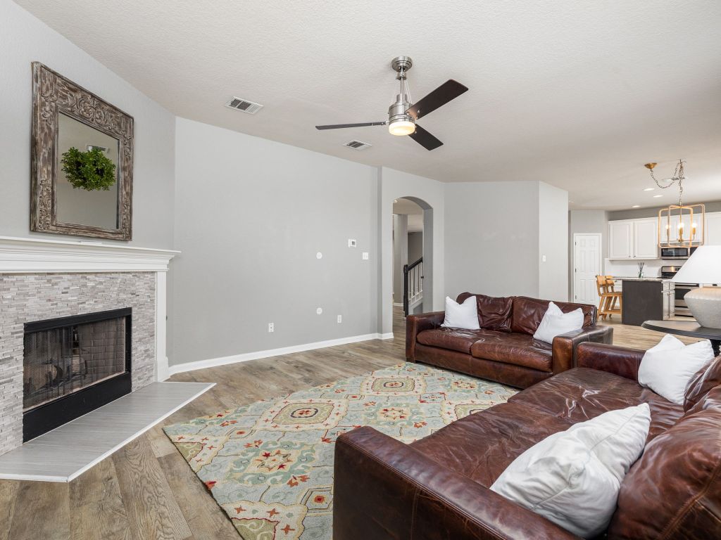 2349 Caprock Place Georgetown, TX 78626 - Photo 9 of 38 a living room with furniture and a fireplace